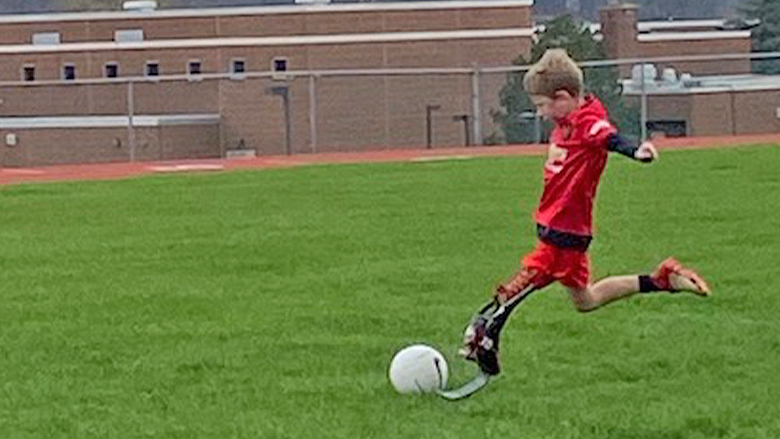 Liam playing soccer