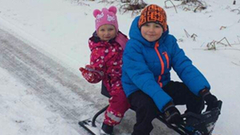 Davis sledding with his sister